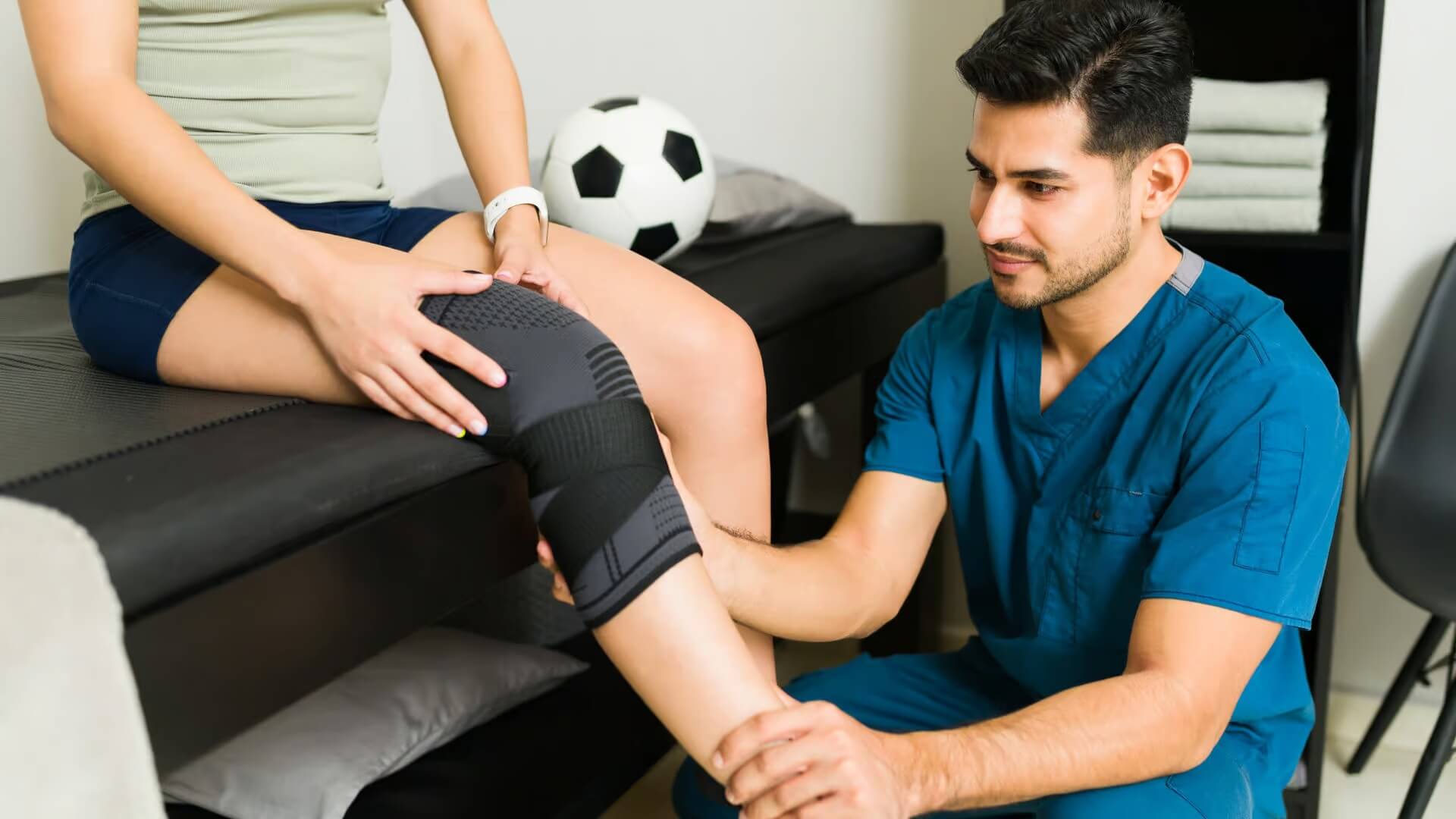 Doctor checking on a patient leg wearing knee brace
