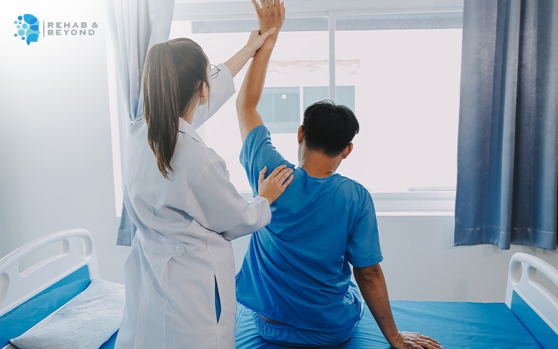 Doctor doing neurological physiotherapy treatment on a patient