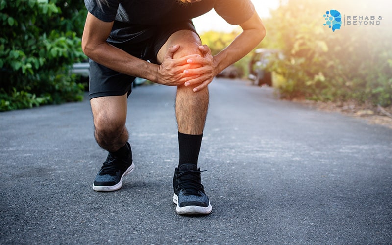 Runner experiencing knee pain due to an overuse injury